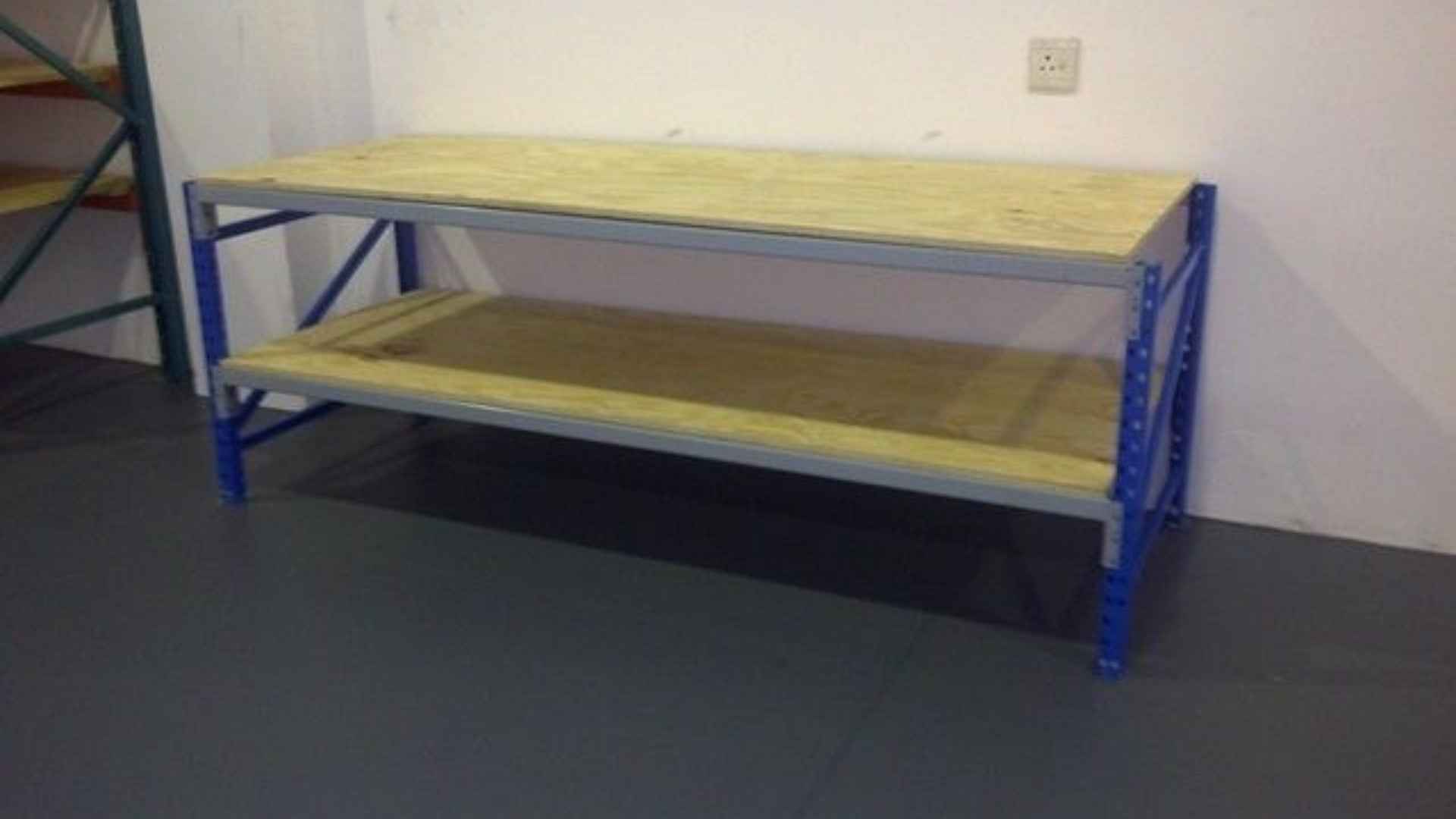 A two-tier shelving unit with blue supports and wooden shelves, designed for efficient storage, provided by Duzi Storage Solutions.